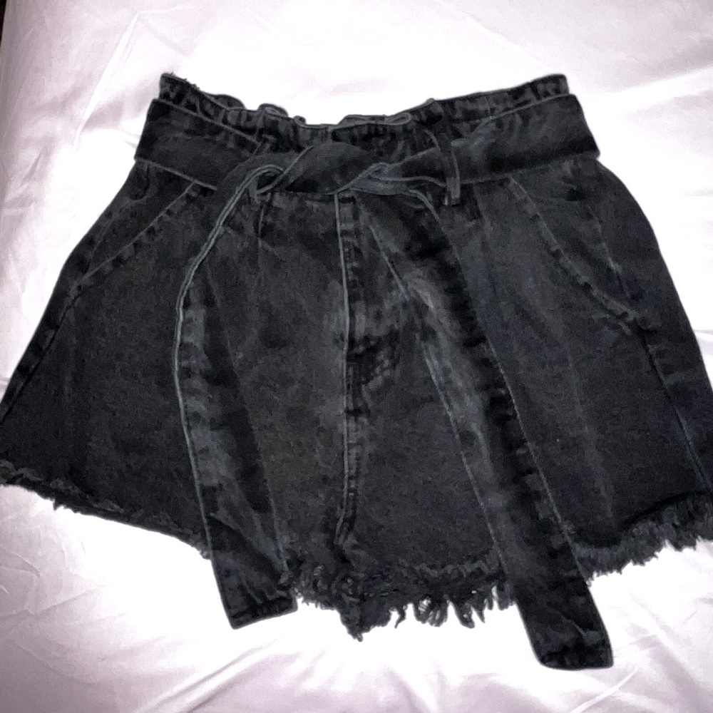 An off black paper bag jean shorts. Never been worn but have been washed.
